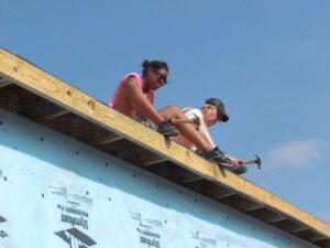 Dentsply GAC Volunteers working on roof.