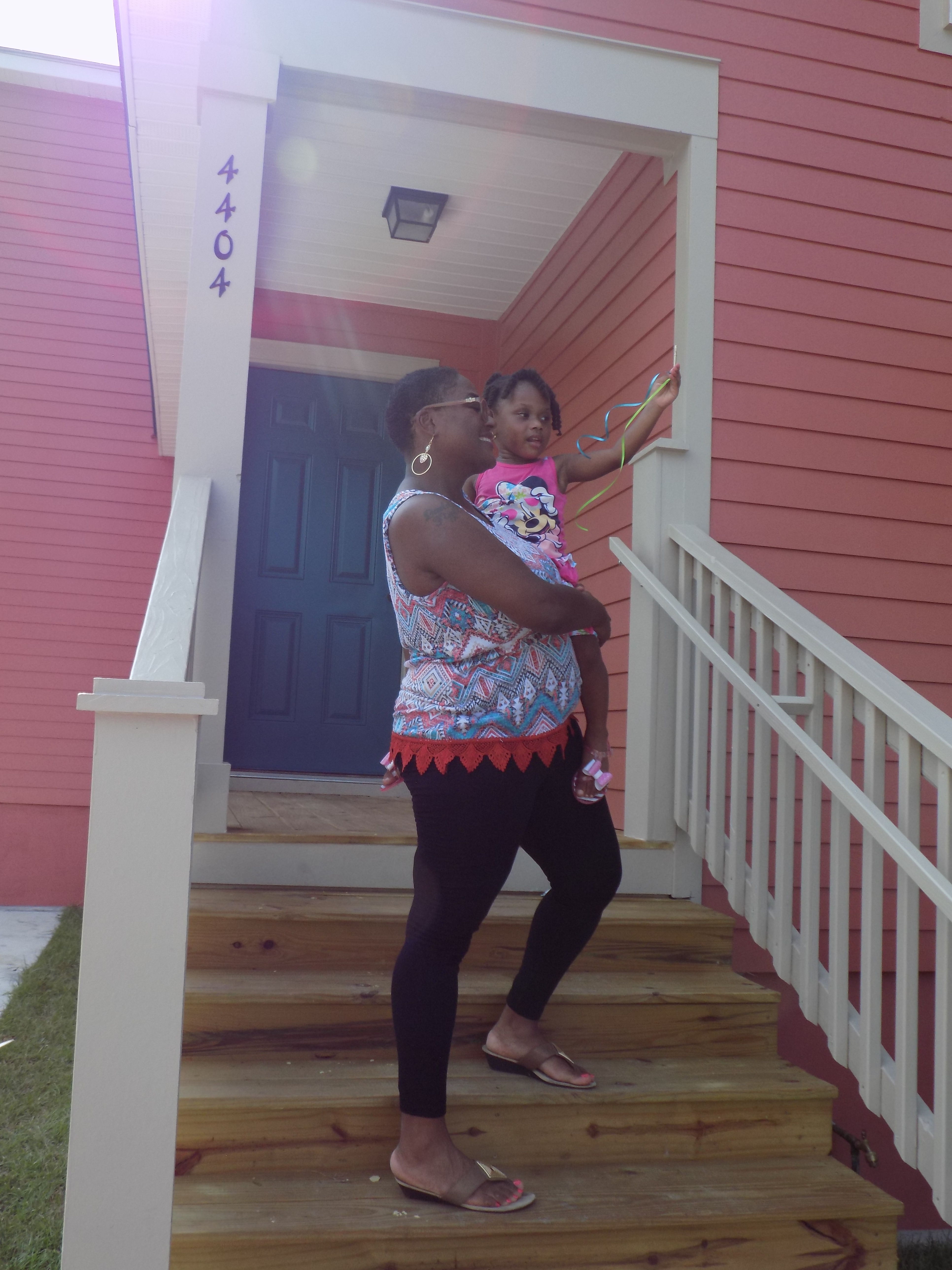 Jackie Rayford and her daughter at her home dedication.