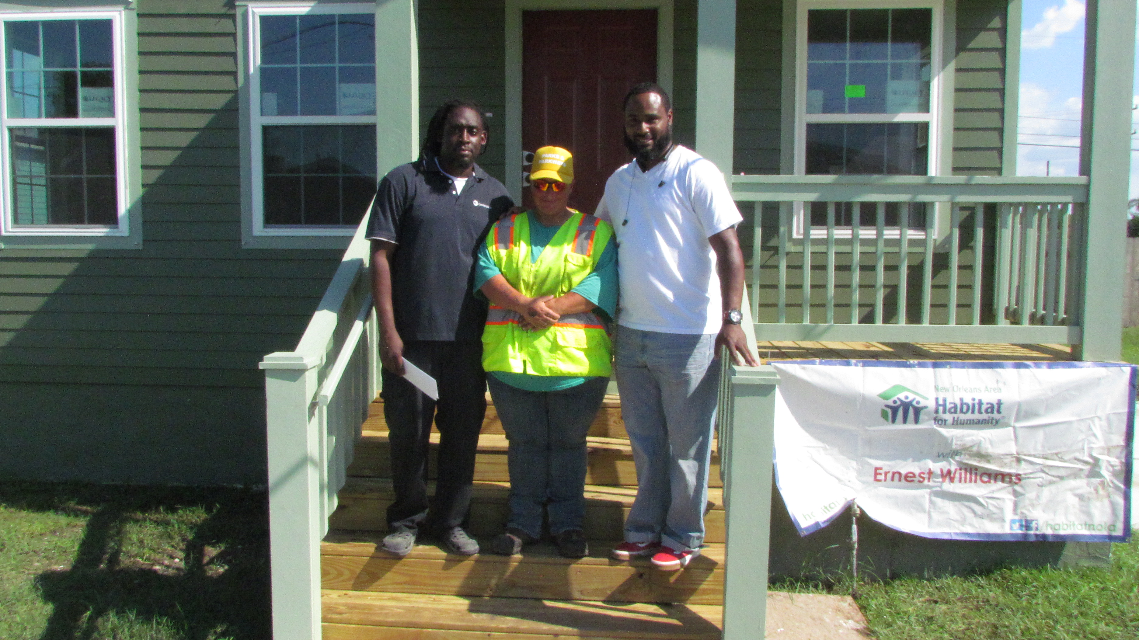 Three Habitat homeowners: Tyrone Morgan, Michelle McDaniel, and Ernest Williams.