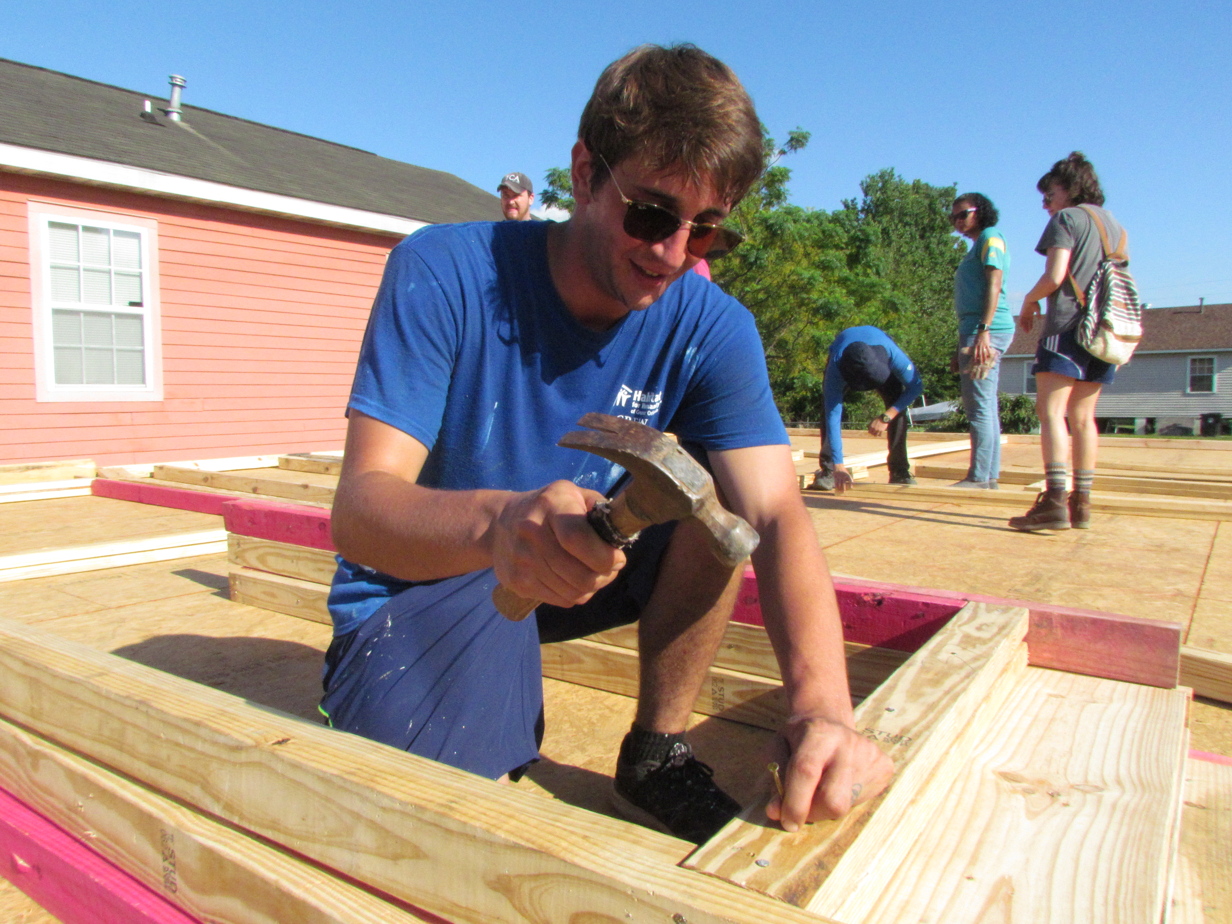 Henry Bot, AmeriCorps, working on the frame of a home.