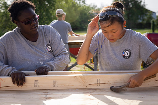 Americorps volunteers working together.